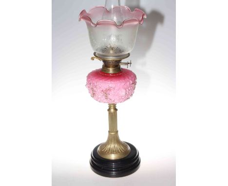Victorian brass column oil lamp with moulded opaque ruby glass reservoir