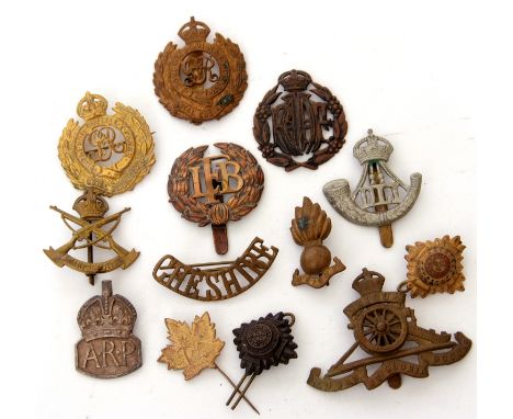 Quantity of 20th century cap badges to include Durham Light Infantry, Royal Artillery, Sharpshooters, ARP cap badge etc