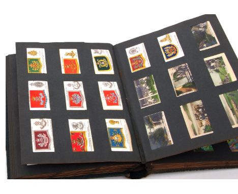 Album containing quantity of cigarette cards, mainly Natural History and some military insignia 