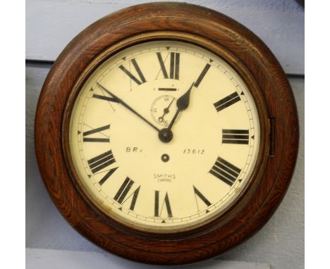 Railway clock, with circular wooden frame, enamel dial with Roman numerals, inscribed BR (E) 13612, clock produced by Smith's