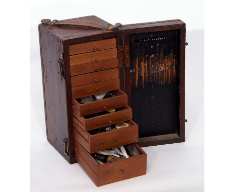 Wooden box containing a selection of watchmaker's tools in original case, with leather strap, the box 30cm long