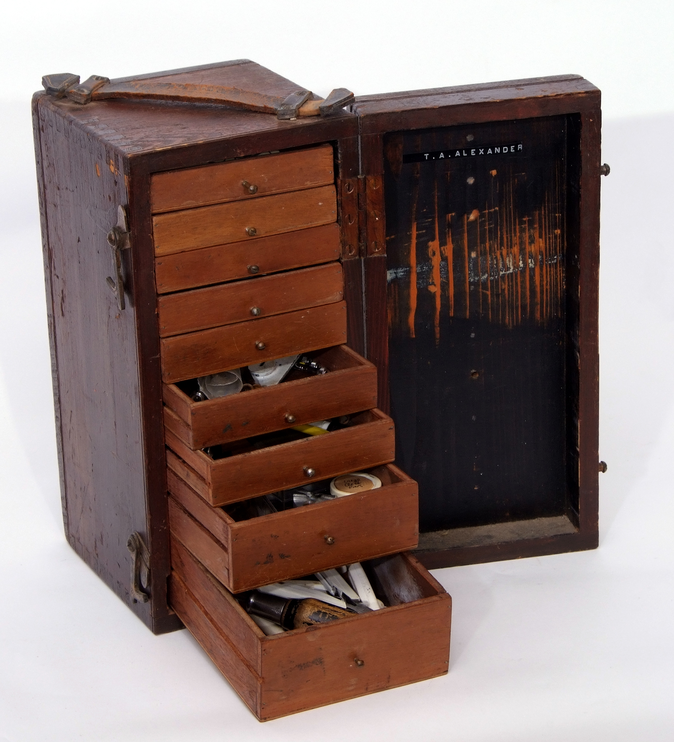 Wooden box containing a selection of watchmaker's tools in original