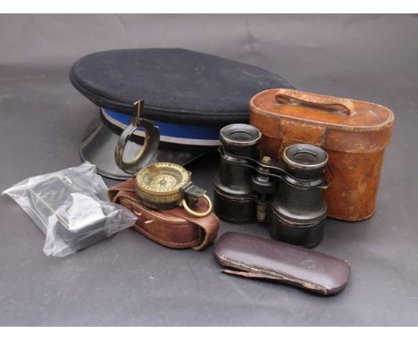 A military peaked cap, pair of binoculars and a marching compass a/f, etc 