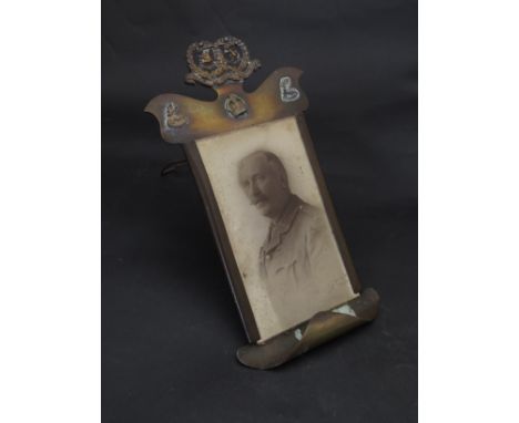 A WWI era trench art brass photograph frame with Argyll and Sutherland Highlanders badge, with portrait a/f 