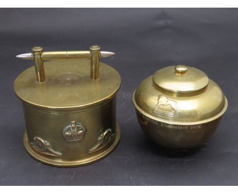 A trench art brass shell storage pot set with R.A. badges and a tea caddy (2)