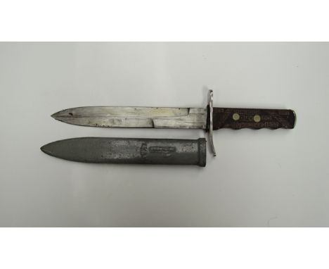 A mid 20th Century Italian M.V.S.N. Italian Blackshirt's dagger bearing text engraved into the grip, with scabbard 