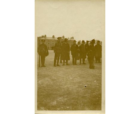 RICHMOND BARRACKS, 1916A monochrome photographic print, 10 x 6cm, depicting three prisoners and soldiers in Richmond Barracks