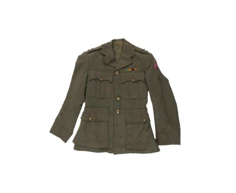 AN IRISH EARLY 20TH CENTURY ARMY TUNIC, in green cloth applied with a string of gilt metal button embelished with the Nationa