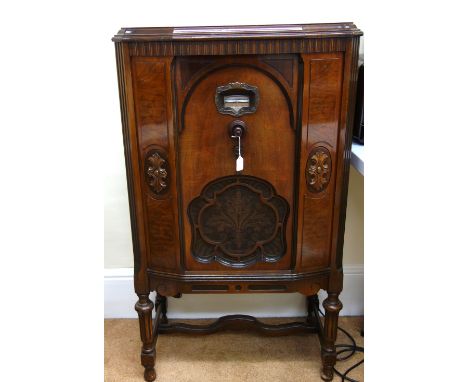 A Brunswick drawing room model cabinet valve radio in carved and moulded walnut cabinet on turned and fluted legs, bakelite f