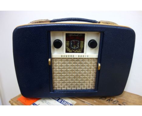 A Bush radio in brown case, original box and receipt for 24th July 1959, and an Ultra Twin De Luxe portable carry case model 