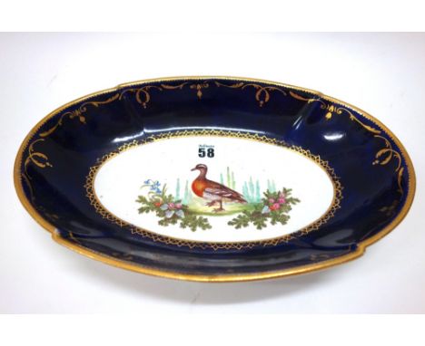 A Spode oval dessert dish, circa 1805-20, centrally painted with a Garganey duck within a cobalt blue border, heightened with