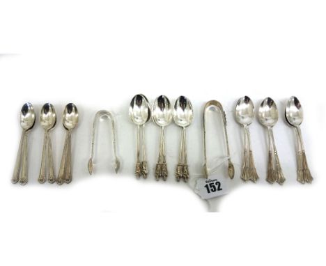 A set of six silver 'apostle'; teaspoons and sugar tongs, Edward Hutton, London 1883 & 1884, six silver Albany pattern teaspo