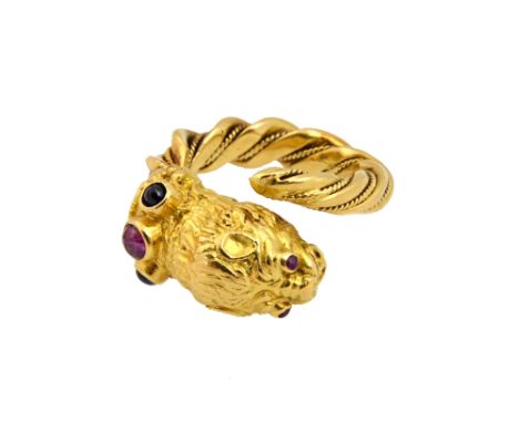 An 18ct yellow gold, cabochon ruby and sapphire Lion ring by Ilias Lalaounis, circa 1979, detailed A21 and 750, 15.6g gross w