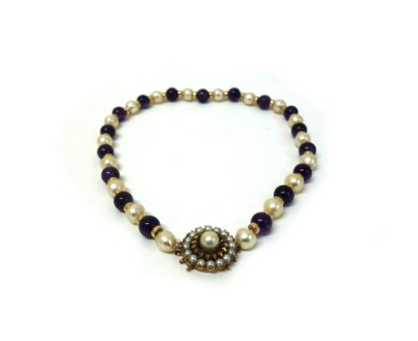 A cultured pearl and amethyst bead necklace, on a 9ct yellow gold, cultured pearl and sapphire clasp, 42cm long.
