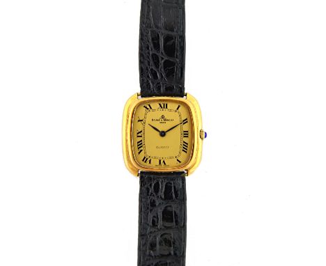 An 18ct yellow gold Baume Mercier lady's quartz wristwatch, with cushion shaped gilt dial and Roman numerals, black leather s