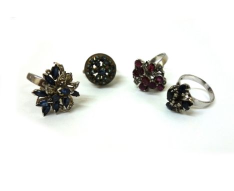 A ruby abstract cluster ring, the white metal setting detailed 14K and three further 14K gem set rings, 23.4g gross. 