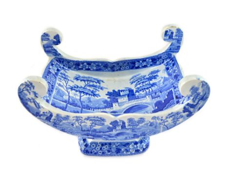 A Spode pearlware cheese coaster, early 19th century, transfer printed in blue with the Tower pattern, 30.5cm wide, impressed