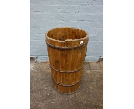 A metal bound cylindrical slatted wooden stick stand, 58cm high.