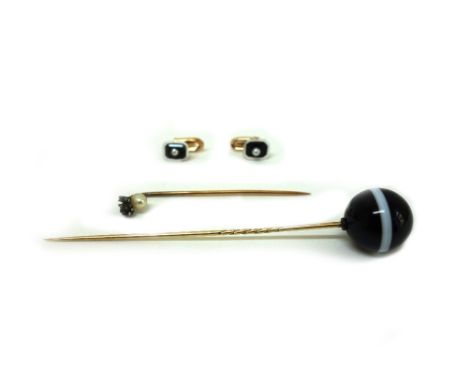 A pair of Continental gold, onyx, pearl and white enamel collar studs, a banded agate bead hat pin, and a gold and pearl stic