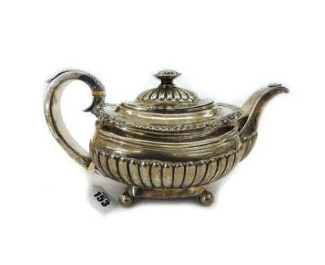 A George III silver teapot, Alice & George Burrows, London 1818, rounded oblong, part lobed and fluted, shell, leaf and gadro