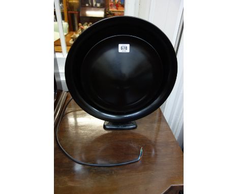 A Philips 'Pancake' speaker in dark brown/black bakelite on painted metal foot, 36cm,.