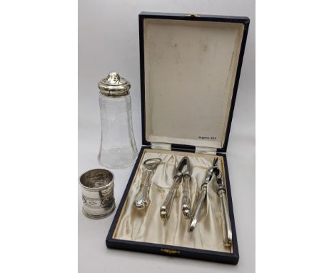 An early 20th century silver topped and glass sugar caster together with a white metal napkin ring, 56g, and an 800 silver ha