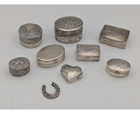 Silver trinket to include examples in rectangular form with floral engraved decoration on a heart shaped example along with a