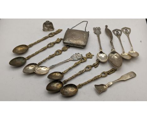 An early 20th century silver hammered purse, together with a silver baby rattle modelled as a bell, together with mixed white