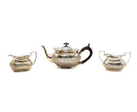 A composite silver three piece tea set, various dates and makers marks rubbed, the teapot 14cm high, 24ozt (3)Condition repor