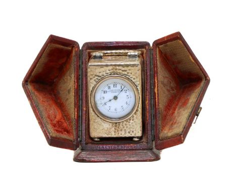 An Edwardian silver miniature carriage clock, by Drew &amp; Sons, Birmingham 1905, the planished case enclosing the white ena