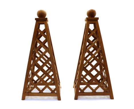 A pair of hardwood obelisks, of pyramid form with lattice decoration and sphere finial, 25cm wide x 59cm highCondition report