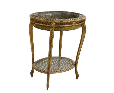 An oval giltwood jardiniere table, with inset galvanised trough and wicker lower shelf. 64cm long, 51cm wide, 75cm highCondit