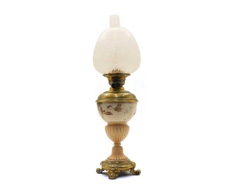 A continental glazed stoneware oil lamp, late 19th century, the upper section of the body with gilt-heightened floral decorat