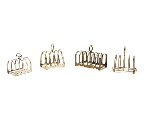 Four various silver toast racks, various dates and makers, the largest, 14cm wide, 6cm deep, 10cm high (4), 14oztCondition re