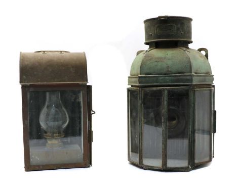 Two 19th century metal lamps, the first and largest of copper and iron with six angled glass panels, by J C &amp; W Lowe , Bi