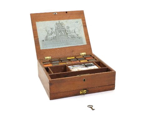 A 19th century artist's mahogany paint box, with R Ackermann &amp; Co label, tray of colour blocks, ceramic mixing trays and 