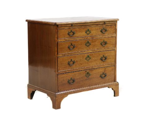 A 19th century mahogany bachelor's chest, the moulded rectangular top over a frieze, containing a pull out dressing slide, ov