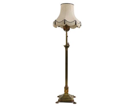 An Edwardian telescope brass standard lamp, originally an oil lamp (now converted to electricity), with Corinthian column and