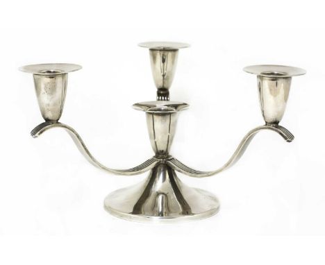 A silver four-branch candelabra, by Garrards, Birmingham 1978, with three sconces mounted on 'S' shaped reeded supports, the 