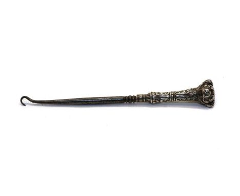 A novelty silver pug dog button hook, Crisford &amp; Norris, Birmingham 1906, the finial in the form of a pug's head with ant