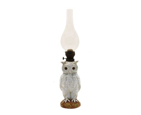 A late 19th/early 20th century continental white porcelain owl oil lamp, with brass burner and glass chimney. 57.5cm to top o