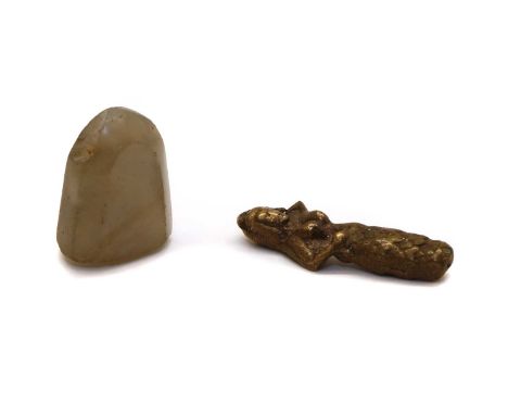 A hardstone intaglio seal, depicting a figure beside a stylised bird, 2.8cm high, together with a miniature bronze figure of 