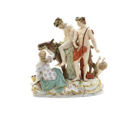 A Meissen porcelain figural group of the drunken Silenus, 19th century, supported by Bacchus and slumped on a donkey being fe