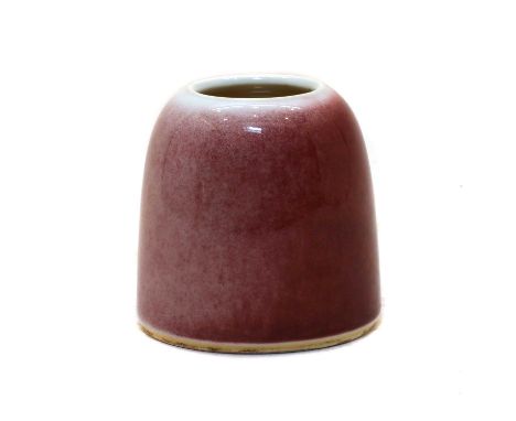 A Chinese copper-red waterpot, well potted in a horse-hoof shape, with steep sides rising up to an incurved mouth with a lipl