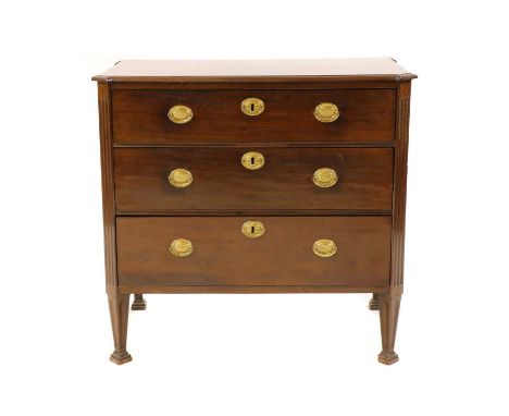 A small continental mahogany commode, 19th century, the shaped top above three long drawers, set between fluted pilasters, ra