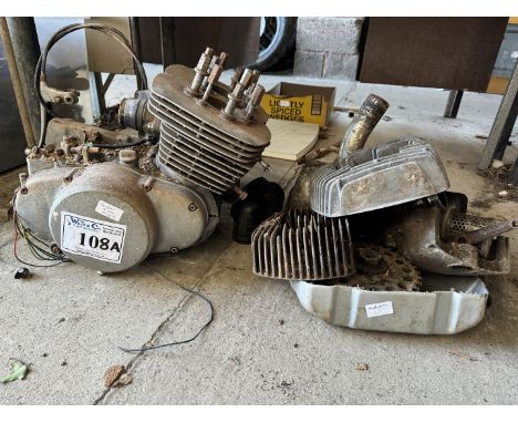 A partially dismantled Suzuki T500 unitary engine/gearbox and parts. Engine turns.