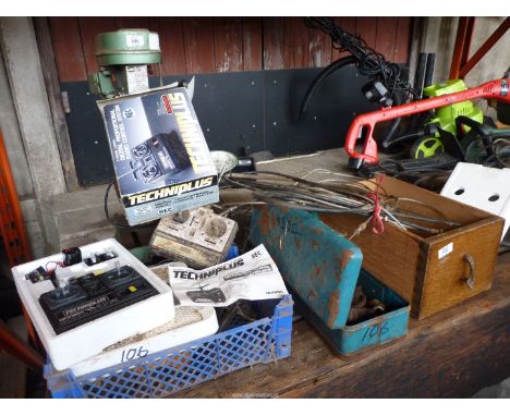 A drawer of miscellaneous including multi tools, a quantity of brake and other cables, a toolbox and contents, a new boxed tw
