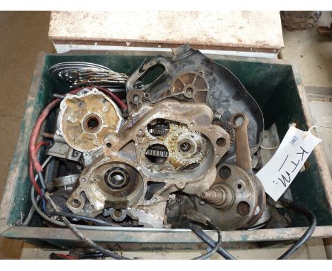 A box of KTM engine and gearbox components.