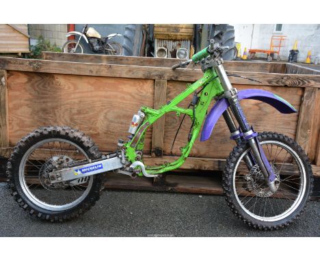 A 1997 Kawasaki KX125 K rolling chassis with disc brakes and some parts including radiators. Frame No. KX125K - 022886. N.B. 