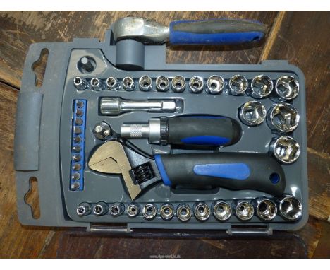 A plastic cased 3/8'' drive socket set with adjustable spanner/ratchet, ratchet screwdriver bits, etc.,